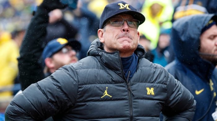 Michigan coach Jim Harbaugh looks on from the sidelines during the Wolverines’ game against Indiana.